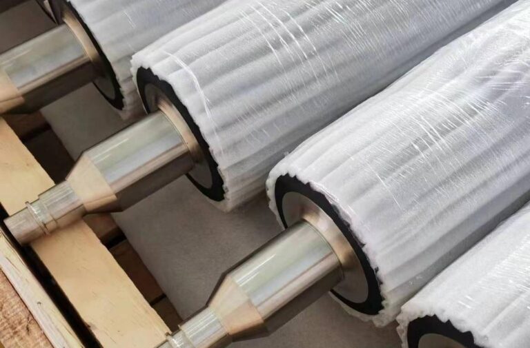 Covered rollers with protective wrapping and metal journals