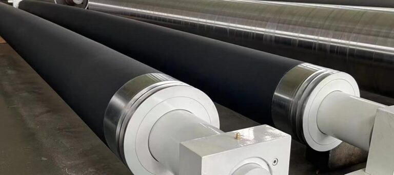 Black covered rollers with exposed metal journals
